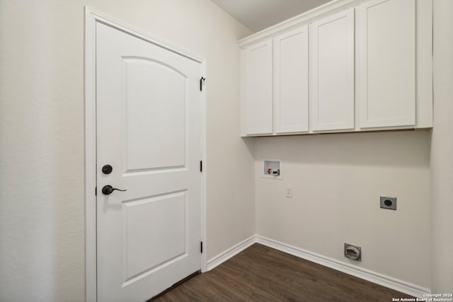 laundry room with electric dryer hookup, hookup for a washing machine, dark hardwood / wood-style flooring, and cabinets