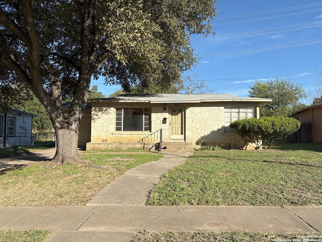 view of front of property with a front lawn