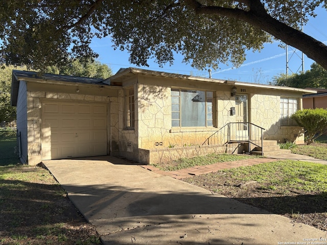 single story home featuring a garage