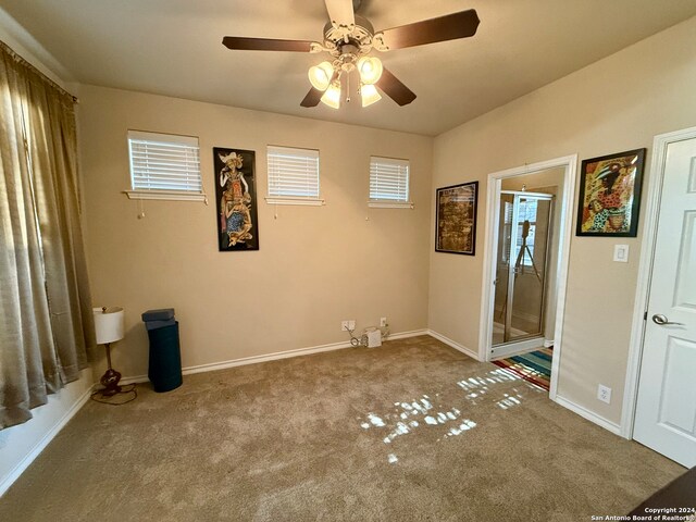 unfurnished bedroom with carpet floors and ceiling fan