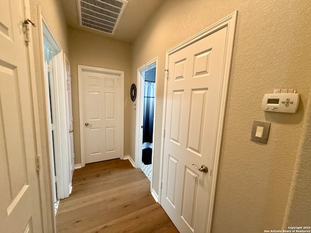 hall featuring wood-type flooring