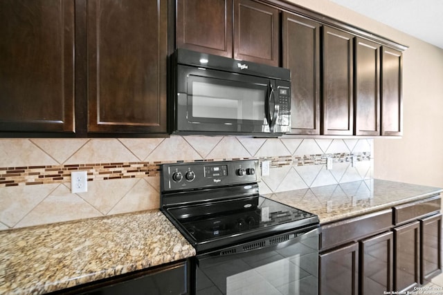 kitchen with dark brown cabinetry, decorative backsplash, black appliances, and light stone counters