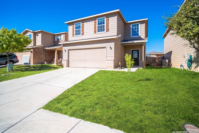 view of front of home with cooling unit, a front yard, and a garage