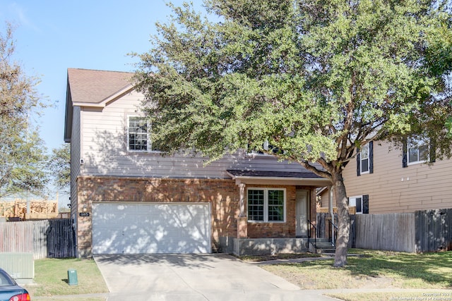 view of front facade featuring a garage and a front lawn