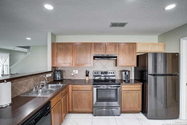 kitchen featuring a textured ceiling, sink, tasteful backsplash, and black appliances