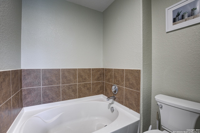 bathroom with toilet and a bathtub