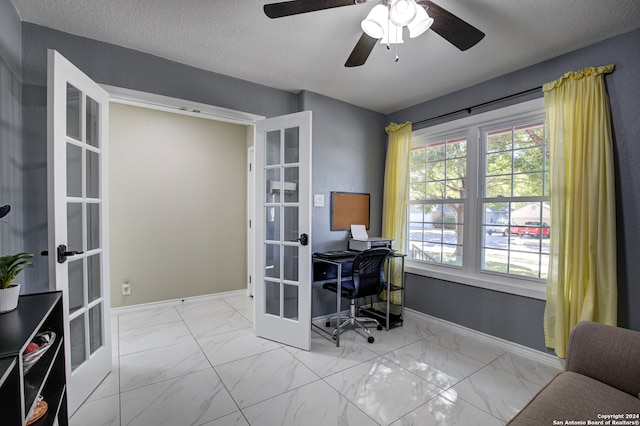 office area with french doors, a textured ceiling, and ceiling fan