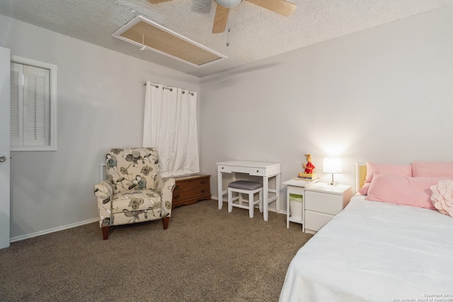 carpeted bedroom featuring ceiling fan and a textured ceiling