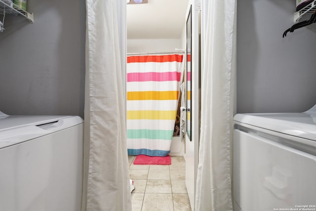 washroom with light tile patterned floors and independent washer and dryer