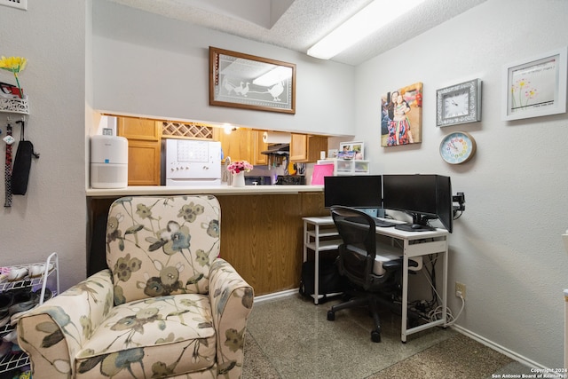 office area with a textured ceiling