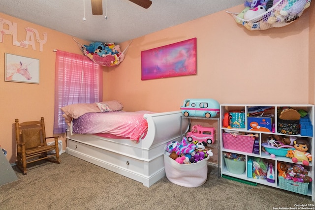 bedroom with carpet flooring, a textured ceiling, and ceiling fan