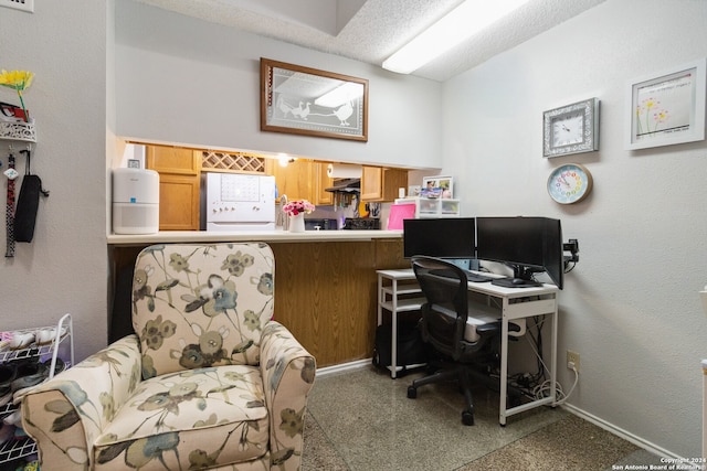 office area with a textured ceiling