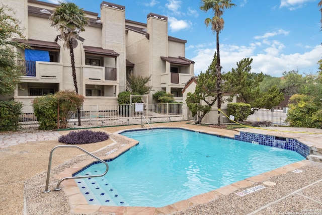 view of swimming pool featuring pool water feature