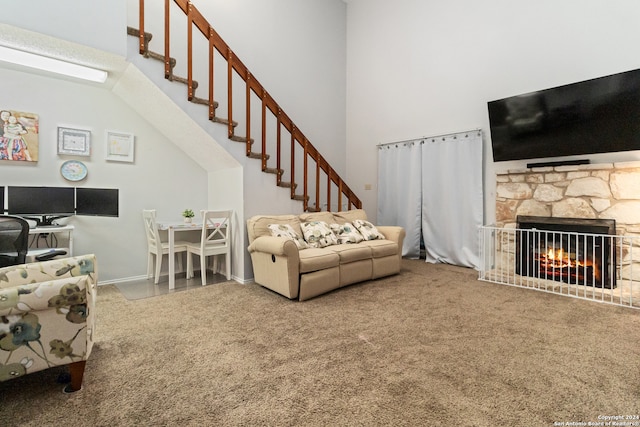 carpeted living room featuring a fireplace