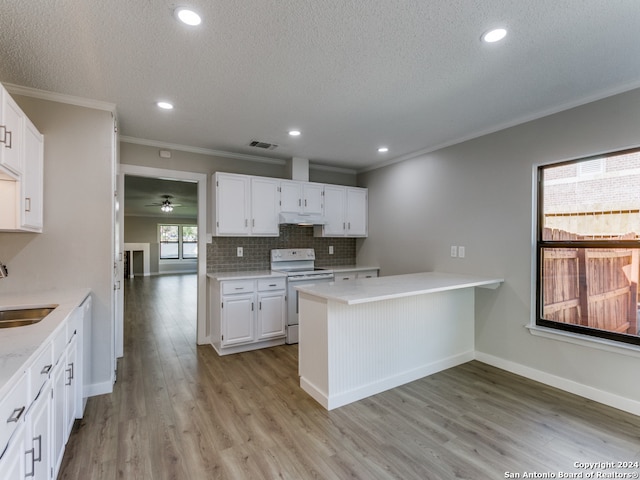 kitchen with white cabinets, white electric range, kitchen peninsula, and light hardwood / wood-style flooring