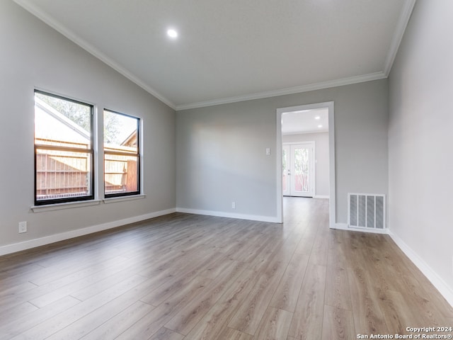 unfurnished room featuring light hardwood / wood-style flooring and ornamental molding