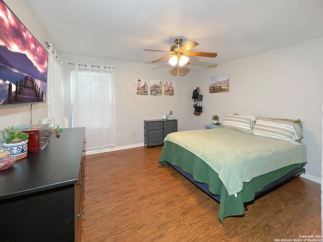 bedroom featuring hardwood / wood-style floors and ceiling fan