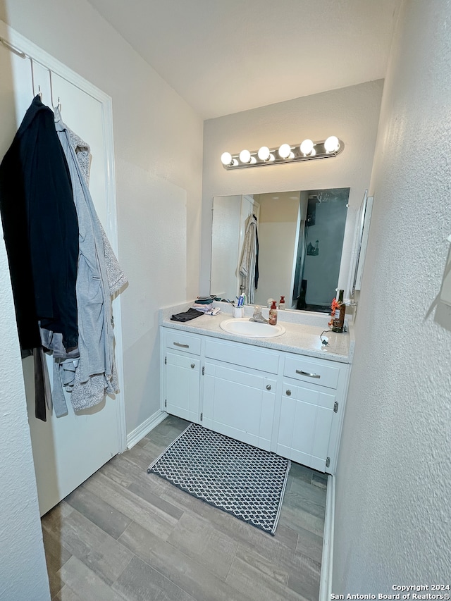 bathroom featuring hardwood / wood-style floors and vanity