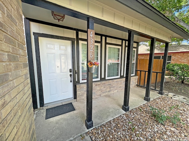 property entrance featuring covered porch