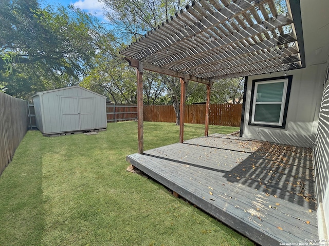 deck featuring a pergola, a yard, and a storage shed