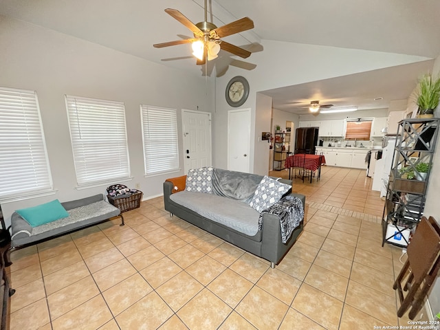 tiled living room with high vaulted ceiling and ceiling fan