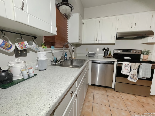 kitchen featuring ventilation hood, stainless steel appliances, sink, light tile patterned floors, and white cabinets