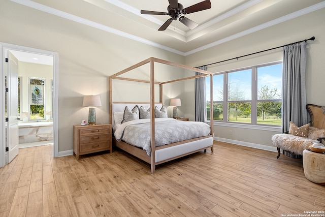 bedroom with ensuite bathroom, crown molding, ceiling fan, and light wood-type flooring