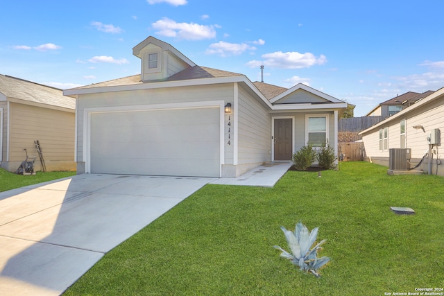 ranch-style house featuring a garage, central air condition unit, and a front yard