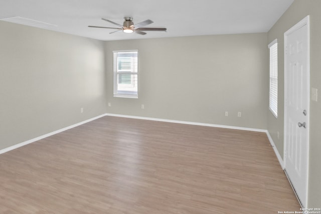 spare room featuring ceiling fan and light hardwood / wood-style flooring