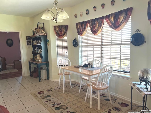 dining space featuring a chandelier, light tile patterned floors, and a healthy amount of sunlight