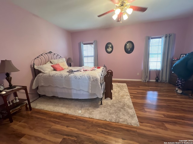 bedroom featuring ceiling fan and dark wood-type flooring