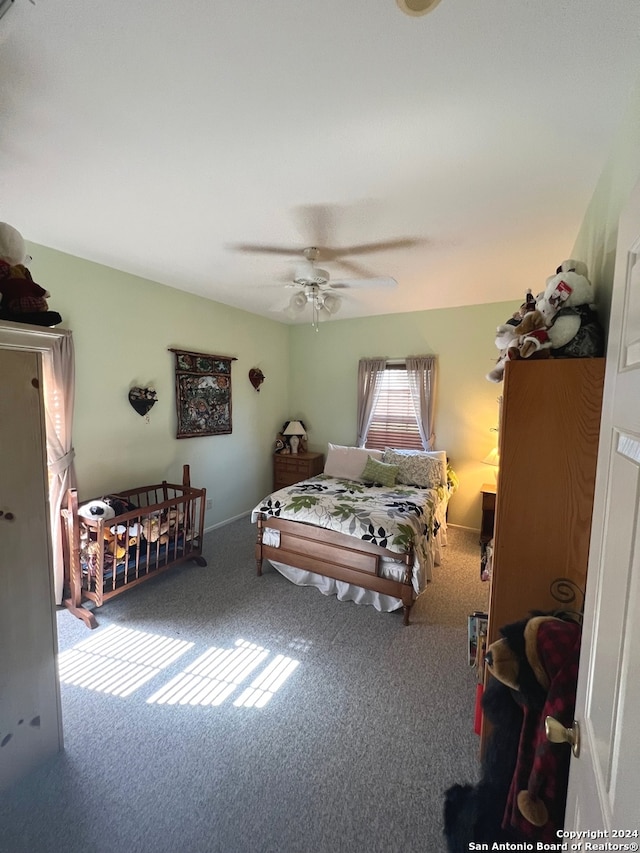 bedroom with ceiling fan and carpet floors