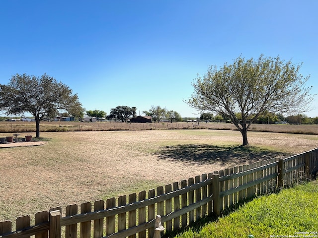 view of yard with a rural view