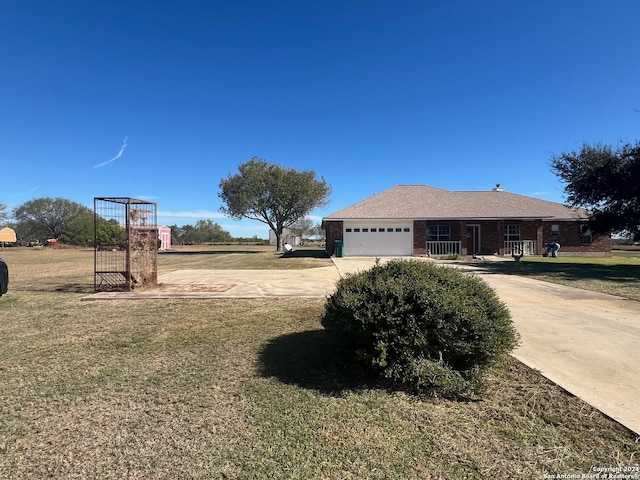 view of side of home featuring a yard and a garage