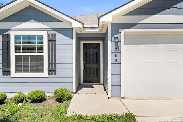 property entrance with a garage