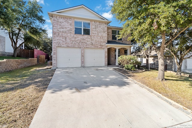 view of front property with a front yard and a garage