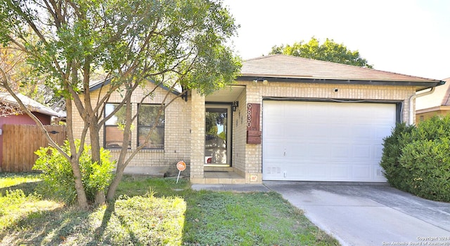 9830 Lauren Mist, San Antonio, TX 78251 - ranch-style home with brick siding, a garage, and driveway