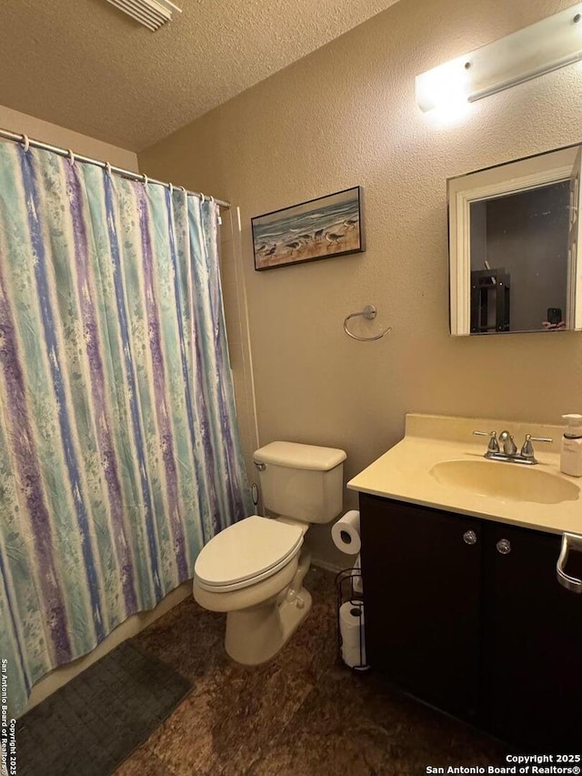 9830 Lauren Mist, San Antonio, TX 78251 - bathroom featuring toilet, vanity, a textured ceiling, and a shower with curtain