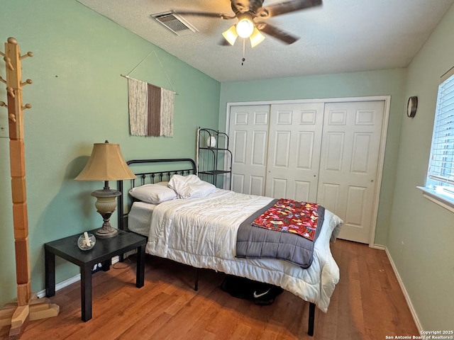 9830 Lauren Mist, San Antonio, TX 78251 - bedroom with wood finished floors, a closet, baseboards, and ceiling fan