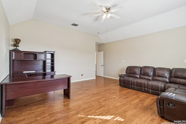 living room with ceiling fan, light hardwood / wood-style flooring, and lofted ceiling