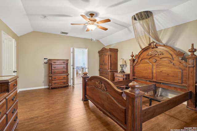 bedroom with lofted ceiling and dark wood-type flooring