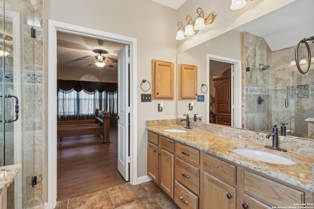 bathroom with hardwood / wood-style floors, ceiling fan, a shower with shower door, and vanity