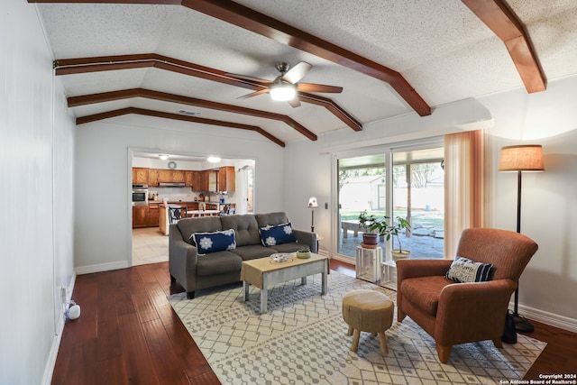 living room featuring a textured ceiling, vaulted ceiling with beams, light hardwood / wood-style floors, and ceiling fan