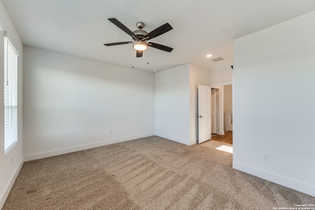 carpeted empty room with ceiling fan