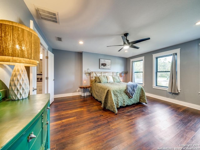 bedroom featuring ceiling fan and dark wood-type flooring