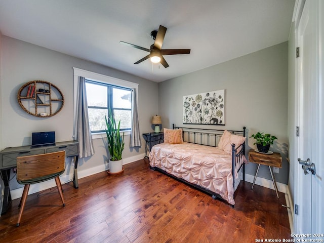 bedroom with ceiling fan and dark hardwood / wood-style floors