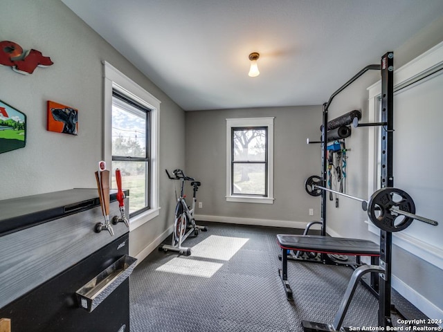 workout room with carpet flooring and a wealth of natural light