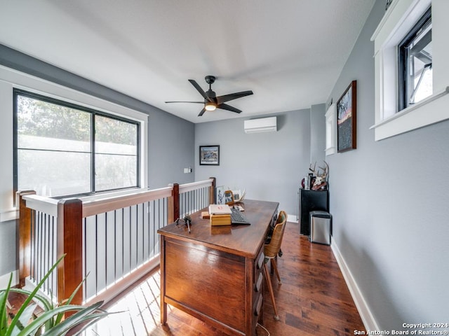 interior space with a wall mounted air conditioner, dark hardwood / wood-style floors, and ceiling fan