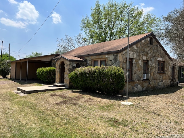 view of front of property with cooling unit and a front lawn