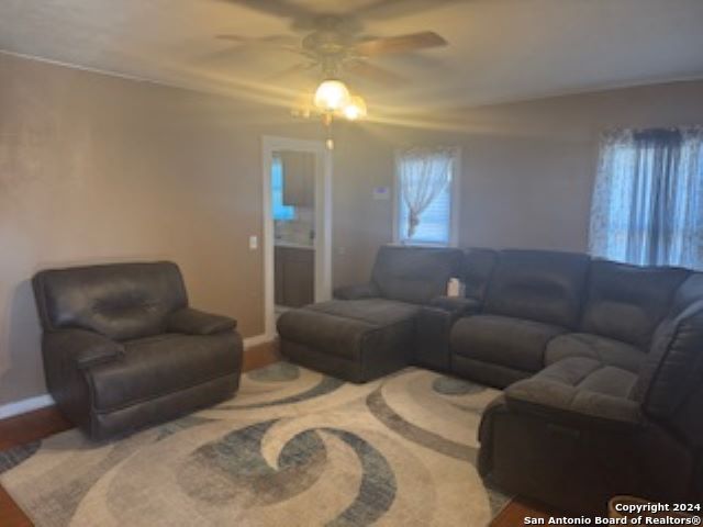 living room with ceiling fan